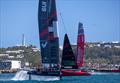 Switzerland SailGP Team helmed by Nathan Outteridge and Emirates Great Britain SailGP Team helmed by Giles Scott in action in front of the grandstand in the Race Stadium on Race Day 1 of the Apex Group Bermuda Sail Grand Prix in Bermuda