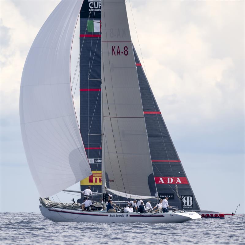 12m KA-8 South Australia passes the AC75 Luna Rossa Prada Pirelli on Louis Vuitton Cup Round Robin Day 6 photo copyright David Maynard / www.alleycatphotographer.com taken at Real Club Nautico de Barcelona and featuring the 12m class