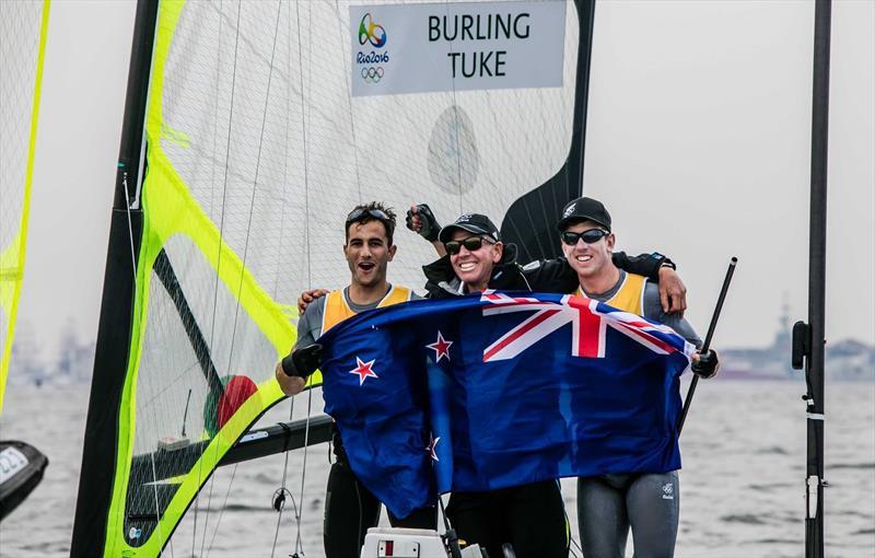 Blair Tuke, Hamish Willcox (Road To Gold co-creator) and Peter Burling celebrate their Gold Medal win after the penultimate race in the 49er at the Rio Olympic Regatta - photo © Emirates Team New Zealand