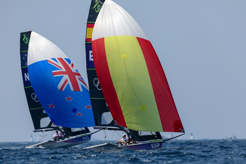 Isaac McHardie and Will McKenzie (NZL) - Silver Medalists trail the Gold Medalists Diego Botin and Paul Trittel (ESP) - Mens Skiff - Paris2024 Olympic Sailing Event - Marseille - August 2, 2024 photo copyright World Sailing / Lloyd Images taken at Royal Akarana Yacht Club and featuring the 49er class