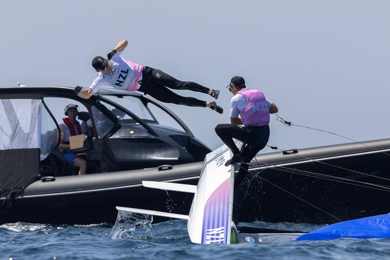 McKiwis take a dive soon after the finish of the Medal Race - Mens Skiff - Paris2024 Olympic Sailing Event - Marseille - August 2, 2024 - photo © World Sailing / Sander van der Borch