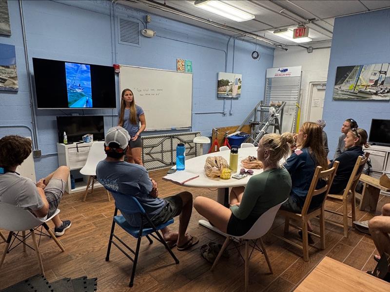 Paris Henken (Rio 2016 49erFX) reviews footage from day one with athletes before day two photo copyright US Sailing taken at  and featuring the 49er FX class