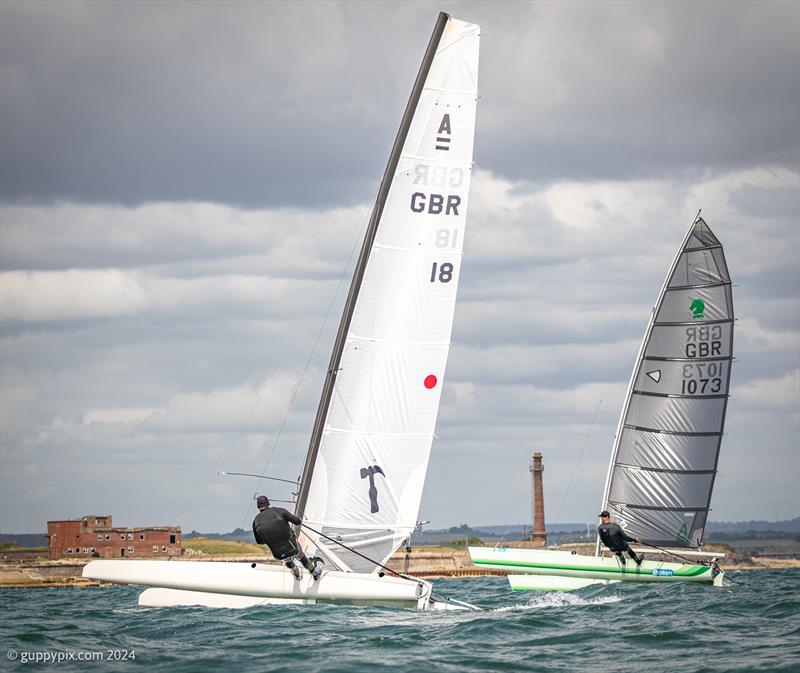 Sisters.  Hugh MacGregor GBR 18 on his A-Cat Tool design, and Grant Piggott GBR 1073 on his Unicorn during the Unicorn and A Class Catamaran Nationals at Hayling Ferry SC photo copyright Gordon Upton / www.guppypix.com taken at Hayling Ferry Sailing Club and featuring the A Class Catamaran class