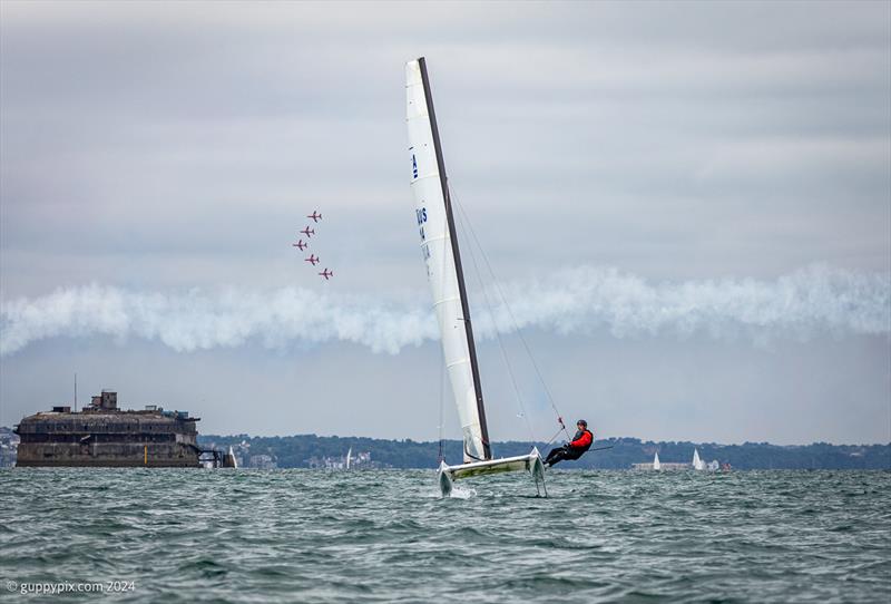 Dave Roberts flying away on his DNA from the Red Arrows 5 ship section during the Unicorn and A Class Catamaran Nationals at Hayling Ferry SC photo copyright Gordon Upton / www.guppypix.com taken at Hayling Ferry Sailing Club and featuring the A Class Catamaran class