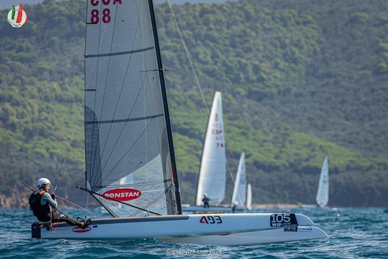 Darren Bundock is lying in second place currently - A Class Cat Worlds at Punta Ala day 2 photo copyright Gordon Upton / www.guppypix.com taken at Centro Velico Punta Ala and featuring the A Class Catamaran class