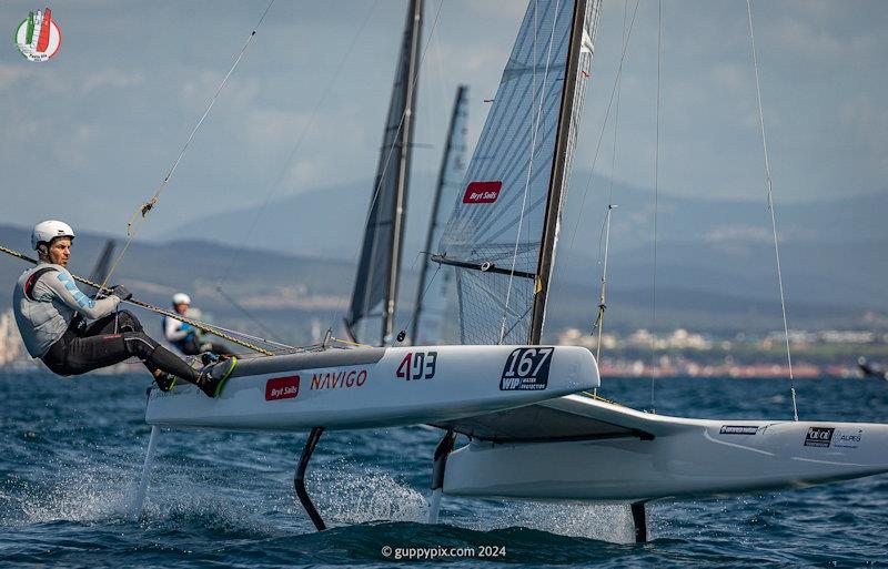 Kuba Surowiec racing hard and fast to retain his World Title - A Class Cat Worlds at Punta Ala day 2 photo copyright Gordon Upton / www.guppypix.com taken at Centro Velico Punta Ala and featuring the A Class Catamaran class