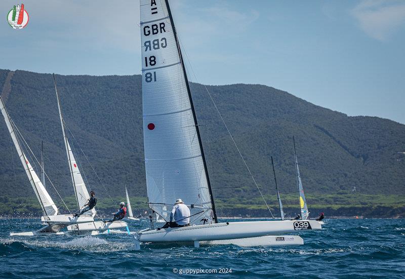 Top GBR sailor Hugh MacGragor having his best sailing day ever  - A Class Cat Worlds at Punta Ala day 2 photo copyright Gordon Upton / www.guppypix.com taken at Centro Velico Punta Ala and featuring the A Class Catamaran class