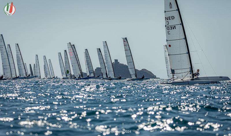 The Classic fleet start on the Golfo Di Follonica - A Class Cat Worlds at Punta Ala day 2 photo copyright Gordon Upton / www.guppypix.com taken at Centro Velico Punta Ala and featuring the A Class Catamaran class