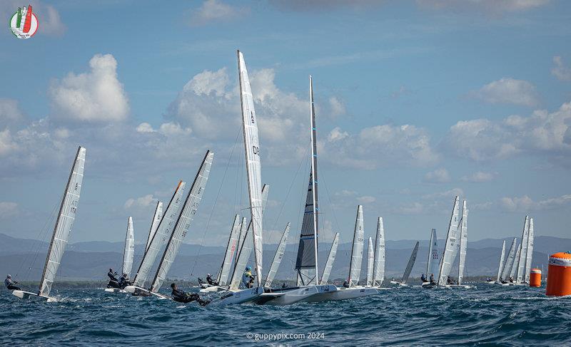 The chasing pack round the first mark on the Open course - A Class Cat Worlds at Punta Ala day 2 photo copyright Gordon Upton / www.guppypix.com taken at Centro Velico Punta Ala and featuring the A Class Catamaran class