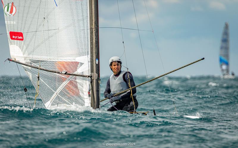 A Class Cat Worlds at Punta Ala - Kuba Surowiec, POL, crosses the line in a masterclass demo of high wind A-Cat foil sailing to win his second and consecutive Open World Championship - photo © Gordon Upton / www.guppypix.com