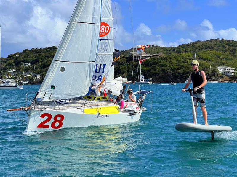 Swiss entry Renaud Stitelmann, winner of the Transat in 22 days 5 hours 26 minutes, sailing in Falmouth Harbour with a deaf sailability skipper and a young Antigua Sailing Club member giving tips on how to cross oceans! - photo © Don McIntyre / MGR2025