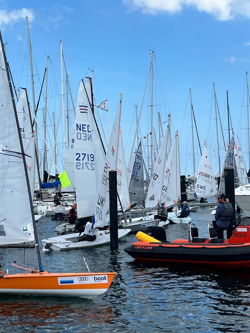 An on-water traffic jam on Saturday during Kieler Woche when five fleets are released to launch at once photo copyright Martin Pascoe taken at Kieler Yacht Club and featuring the Contender class