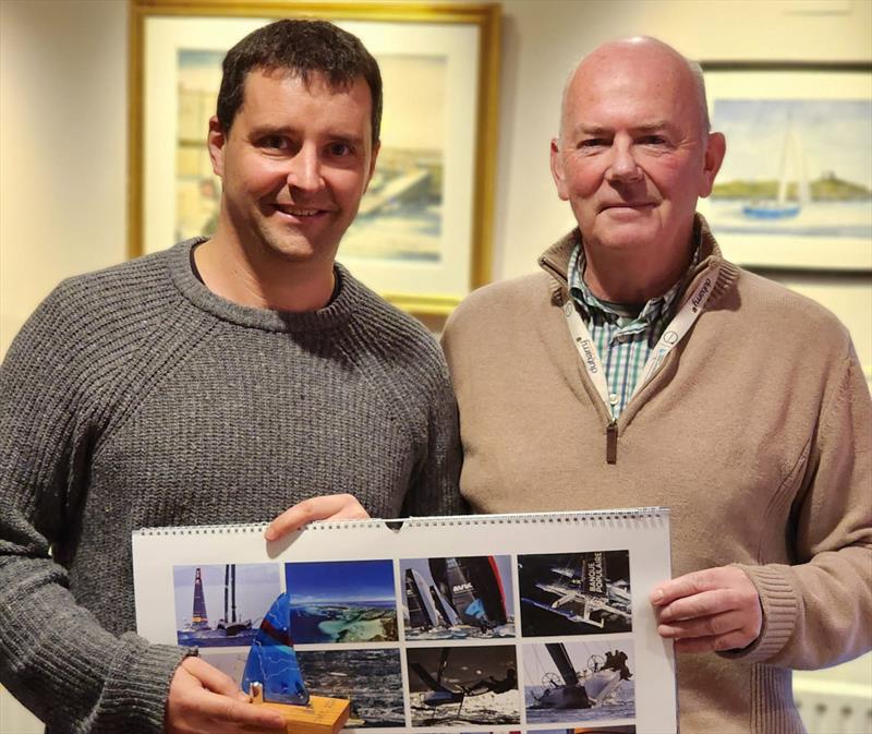  ILCA 7s, 2nd Overall, Niall Cowman, with DMYC Commodore Derek Gill. Viking Marine Frostbites Series Series 1 prize-giving photo copyright Frank Miller taken at Dun Laoghaire Motor Yacht Club and featuring the Dinghy class