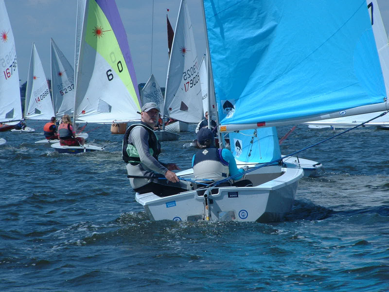 The leading crewed boat is the Enterprise of Ken & Jacinta White at Mudeford Week photo copyright Mike Roach taken at Mudeford Sailing Club and featuring the Enterprise class