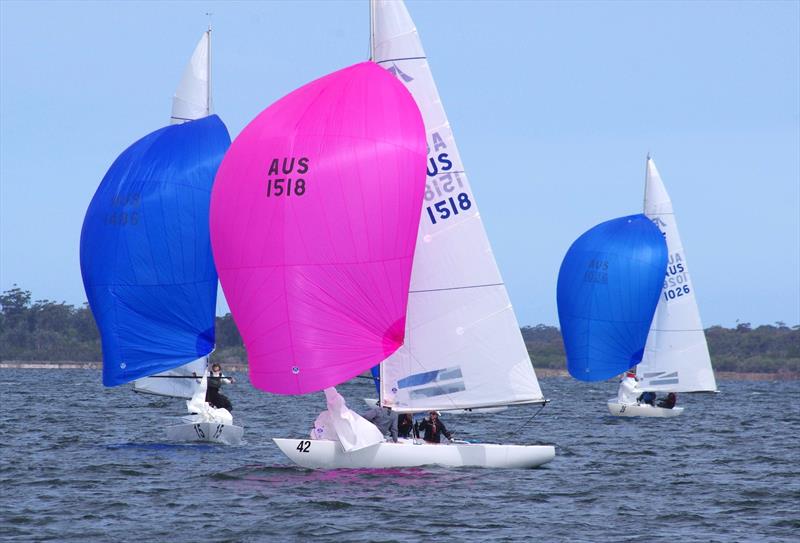 Flying High 2 AUS1518 with helm Jeanne-Claude Strong, heads to the leeward gate, with Magpie AUS1486 trying to intercept, and Flirtation AUS1026 behind, in the Etchells 2025 Australian championship regatta photo copyright Jeanette Severs taken at Metung Yacht Club and featuring the Etchells class