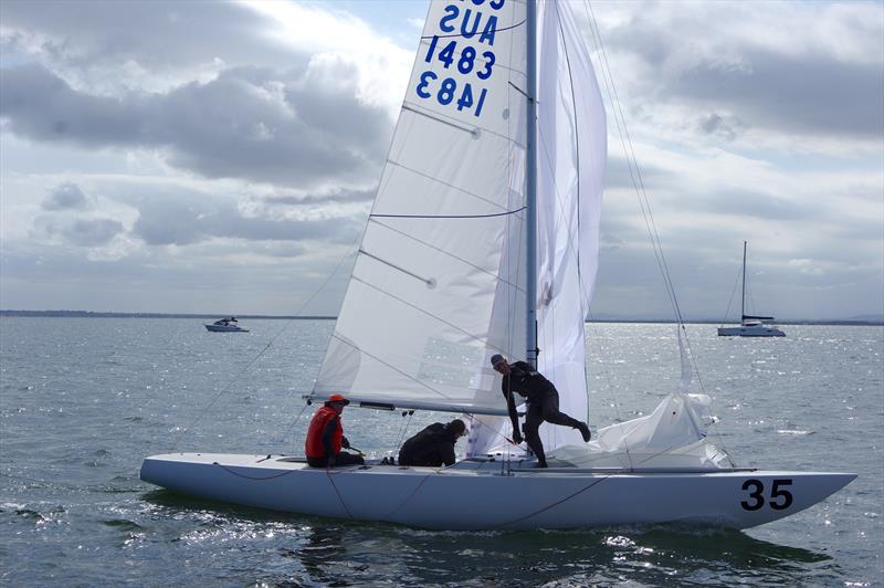 The crew of Great White Hunter AUS1483, Sandy Higgins and Peter Bellingham, pull down the spinnaker, as David Dunn helms her across the finish line, to be third in race 7 of the Etchells 2025 Australian championship - photo © Jeanette Severs