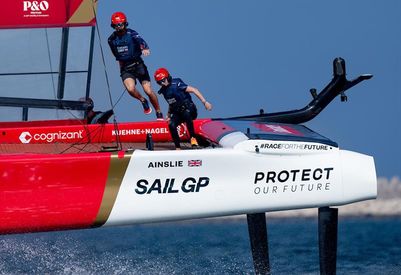 Hannah Mills, strategist of Emirates Great Britain SailGP Team, and Iain Jensen, wing trimmer of Emirates Great Britain SailGP Team, runs across the boat on Race Day 1 of the Emirates Sail Grand Prix presented by P&O Marinas in Dubai, United Arab Emirates - photo © Bob Martin for SailGP