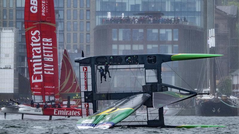 Australia SailGP Team capsize during the second race as Emirates Great Britain SailGP Team  sail past on Race Day 2 of the Rockwool Canada Sail Grand Prix in Halifax, Canada  - June 2, 2024 - photo © Ricardo Pinto/SailGP