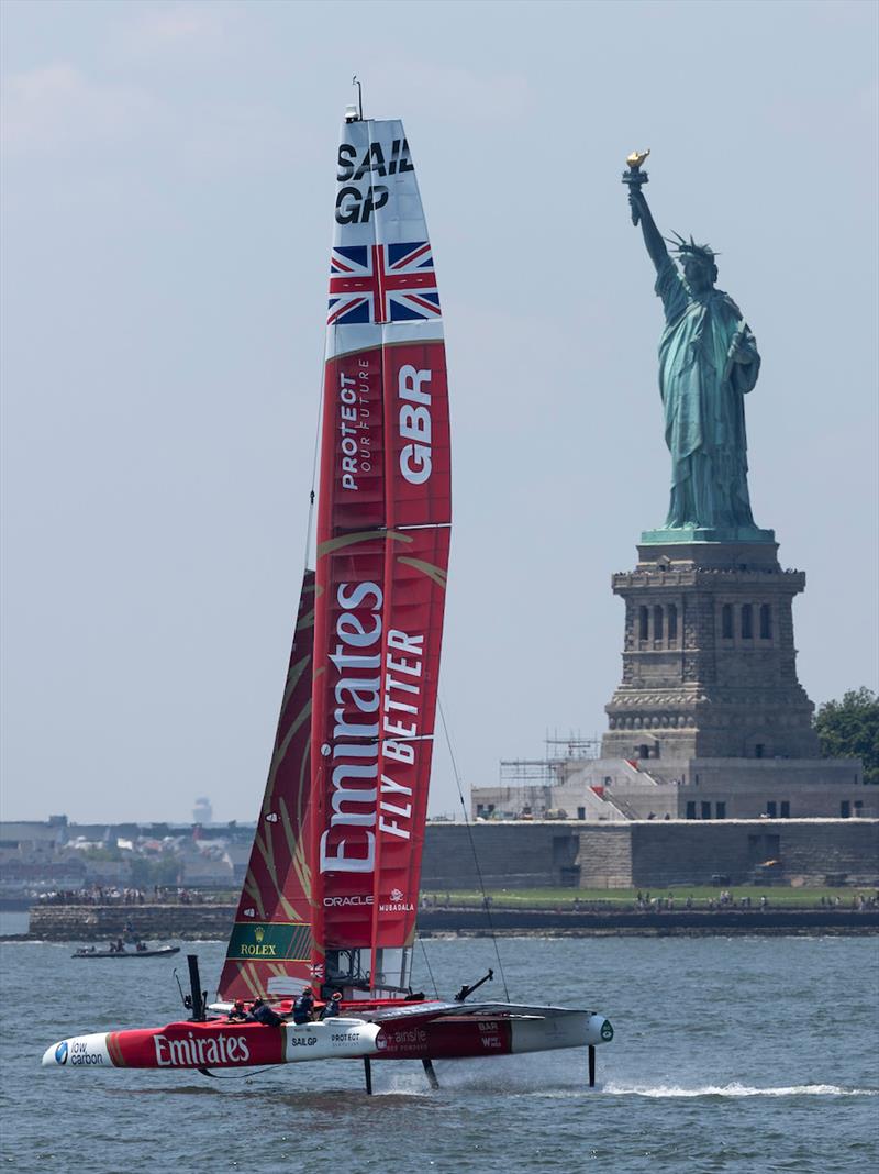 The Emirates Great Britain SailGP Team F50 catamaran in front of the Statue of Liberty ahead of the Mubadala New York Sail Grand Prix in New York, USA photo copyright Jed Jacobsohn for SailGP taken at  and featuring the F50 class