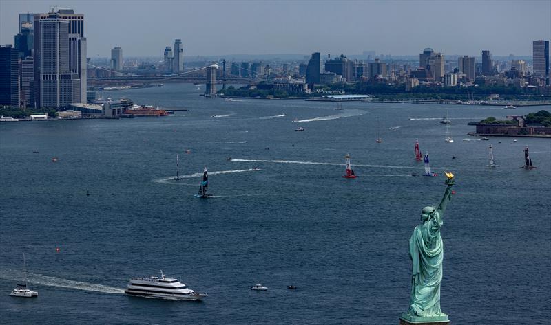 The fleet sail past the Statue of Liberty on  Race Day 2 of the Mubadala New York Sail Grand Prix - June 23, 2024  - photo © Felix Diemer for SailGP