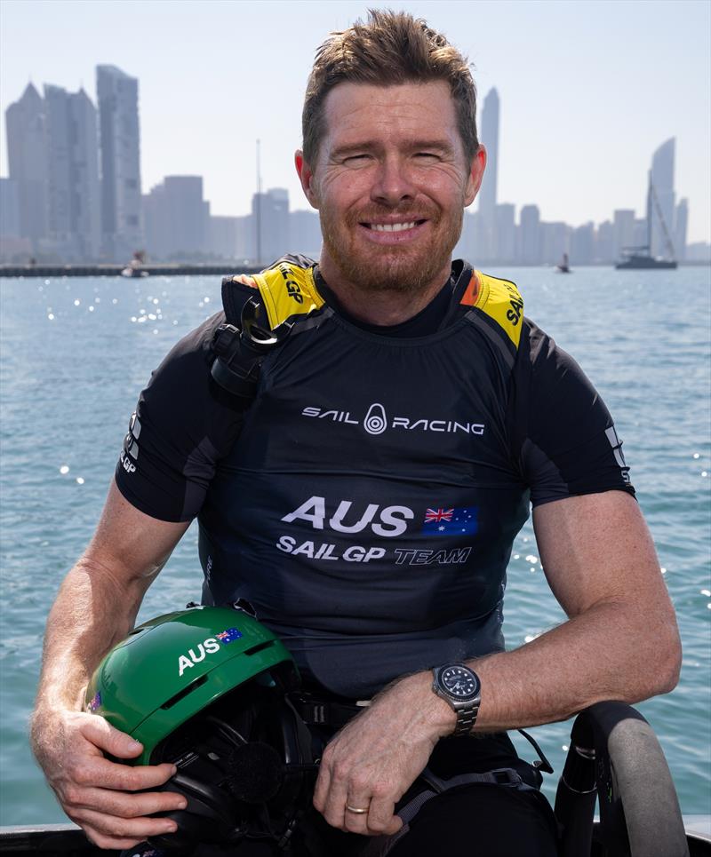 Tom Slingsby in front of the skyline on board the Australia SailGP Team F50 Catamaran ahead of racing on Race Day 2 of the Mubadala Abu Dhabi Sail Grand Prix presented by Abu Dhabi Sports Council in Abu Dhabi, United Arab Emirates photo copyright Felix Diemer for SailGP taken at  and featuring the F50 class