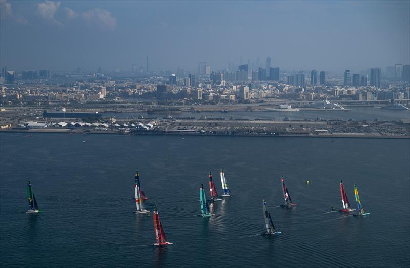 Mubadala Brazil SailGP Team helmed by Martine Grael leads the SailGP F50 catamaran fleet from Canada NorthStar SailGP Team helmed by Giles Scott and Switzerland SailGP Team helmed by Sebastien Schneiter on Race Day 1 of the Emirates Dubai Sail Grand Prix photo copyright Jon Buckle for SailGP taken at  and featuring the F50 class