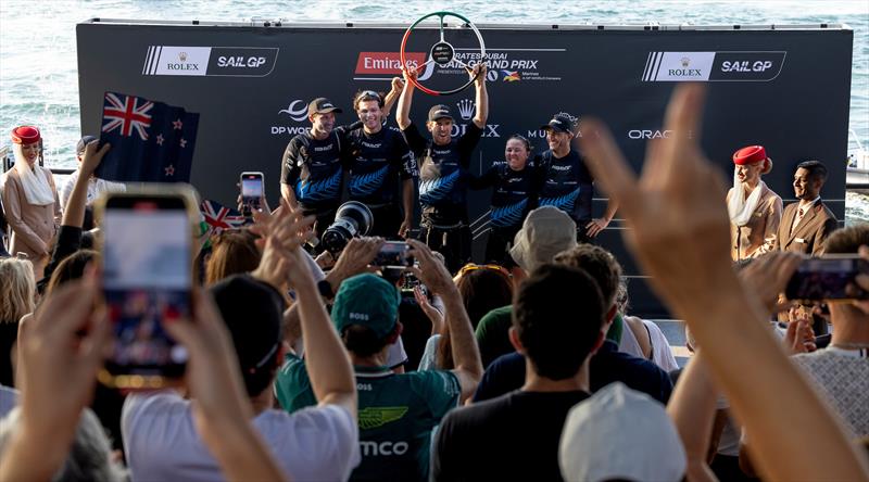 Peter Burling, co-CEO and driver of New Zealand SailGP Team, celebrates victory on the podium with the New Zealand SailGP Team on Race Day 2 of the Emirates Dubai Sail Grand Prix - photo © Christopher Pike/SailGP