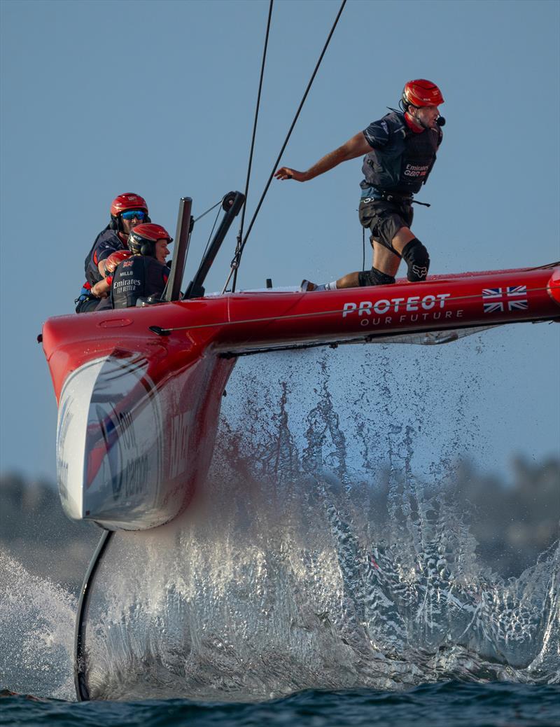 Nick Hutton, grinder of Emirates Great Britain SailGP Team, crosses the boat as Emirates Great Britain SailGP Team helmed by Dylan Fletcher rises on the foil on Race Day 2 of the Emirates Dubai Sail Grand Prix presented by P&O Marinas in Dubai, UAE photo copyright Ricardo Pinto for SailGP taken at  and featuring the F50 class