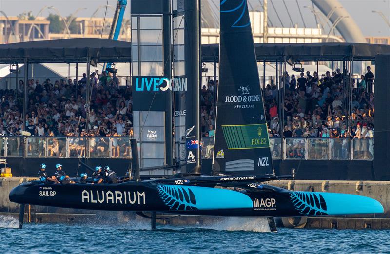 New Zealand SailGP Team helmed by Peter Burling sail past spectators in the SailGP Race Stadium as they cross the finish line to win Emirates Dubai Sail Grand Prix presented by P&O Marinas in Dubai, UAE photo copyright Felix Diemer for SailGP taken at  and featuring the F50 class