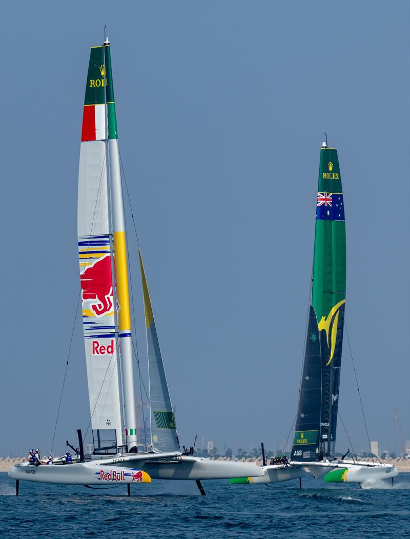 Red Bull Italy SailGP Team helmed by Ruggero Tita and Australia SailGP Team helmed by Tom Slingsby in action during practice ahead of the Emirates Dubai Sail Grand Prix presented by P&O Marinas in Dubai, UAE photo copyright Felix Diemer for SailGP taken at  and featuring the F50 class