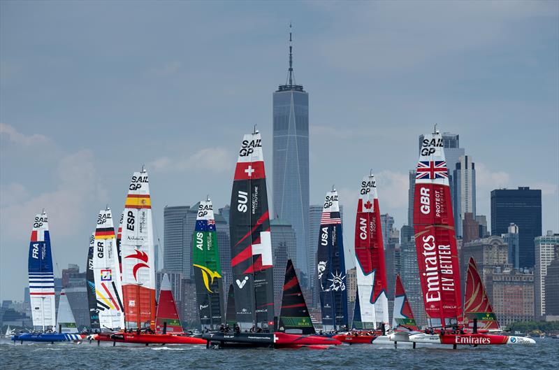 The fleet led by Emirates Great Britain SailGP Team ahead of Canada SailGP Team and USA SailGP Team pass One World Trade Centre and the New York City skyline on Race Day 2 of the Mubadala New York Sail Grand Prix - June 2024 photo copyright Bob Martin/SailGP taken at Royal New Zealand Yacht Squadron and featuring the F50 class