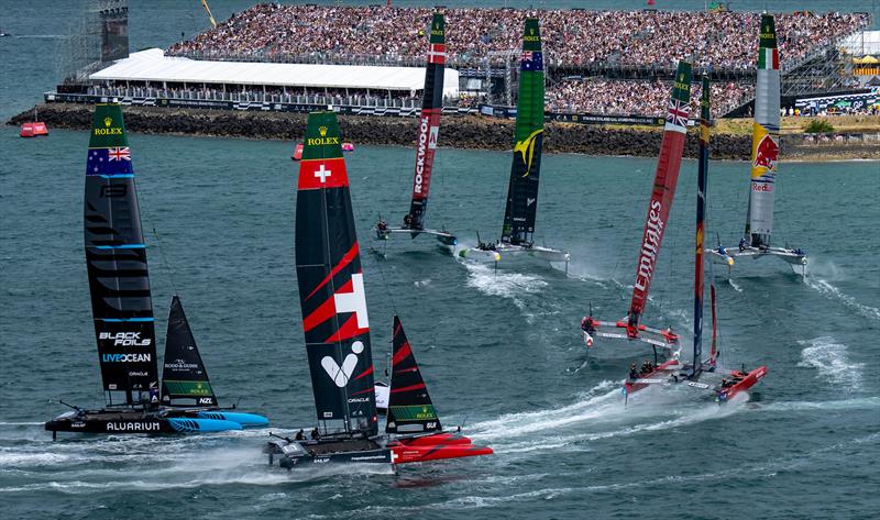 Teams round the finish marker in front of the grandstand full of spectators on Race Day 2 of The Rolex SailGP Championship ITM New Zealand Sail Grand Prix in Auckland - photo © Bob Martin for SailGP