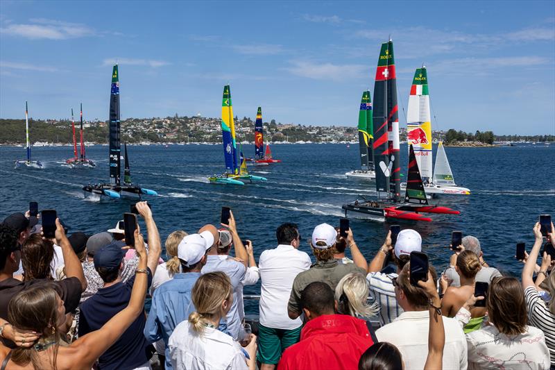 Spectators watching the close racing action from on board the Adrenaline Yacht as Switzerland SailGP Team helmed by Sebastien Schneiter lead the fleet ahead of Red Bull Italy SailGP Team on Race Day 1 of the KPMG Australia Sail Grand Prix photo copyright Brett Phibbs for SailGP taken at  and featuring the F50 class