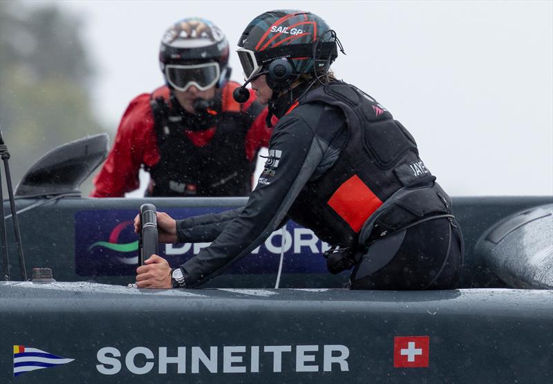 Maud Jayet, strategist of Switzerland SailGP Team, takes control of the wheel during practice racing ahead of the Rolex Los Angeles Sail Grand Prix held in the Port of Los Angeles, California, USA photo copyright Felix Diemer for SailGP taken at  and featuring the F50 class