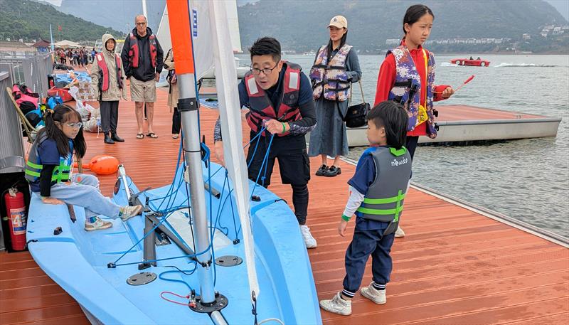 Dad showing his kids the ropes during the Shuifu Jinshajiang River Regatta photo copyright Mark Jardine taken at  and featuring the FD Future class