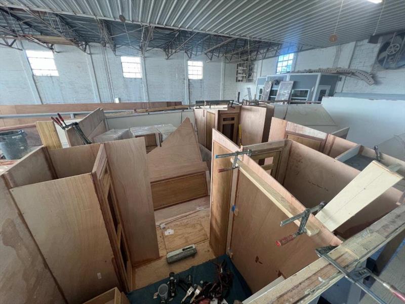 Hull #11 - Forward bulkhead installation - photo © Michael Rybovich & Sons