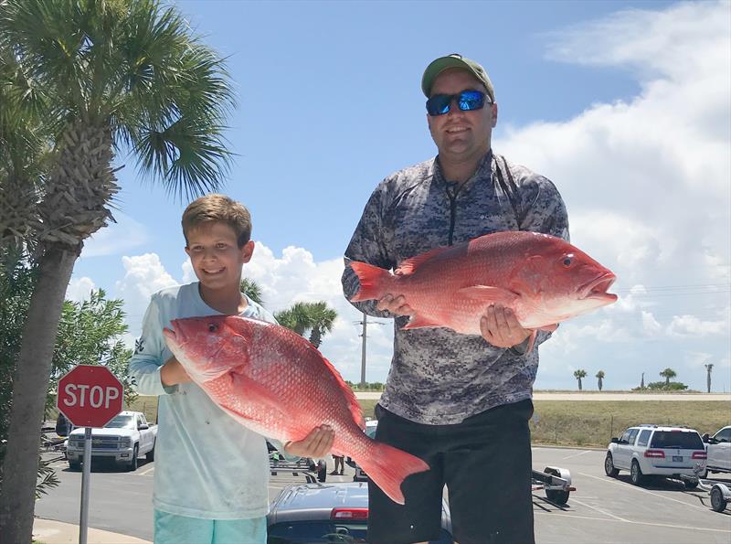 Two fishermen holding red snapper. Photo submission for NOAA Fisheries Southeast Fishing Photo Contest photo copyright NOAA Fisheries taken at  and featuring the Fishing boat class