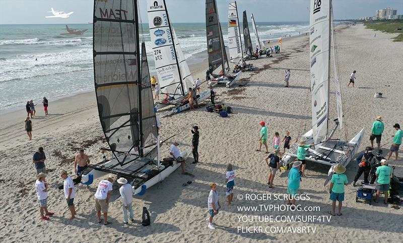 Malcolm Denemark getting last minute prep photos of the Cocoa Beach start of the Worrell 1000 Race photo copyright Roger Scruggs taken at  and featuring the Formula 18 class