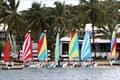 Colorful Hobie Waves on the STYC beach at STIR 2024 © Ingrid Abery / www.ingridabery.com