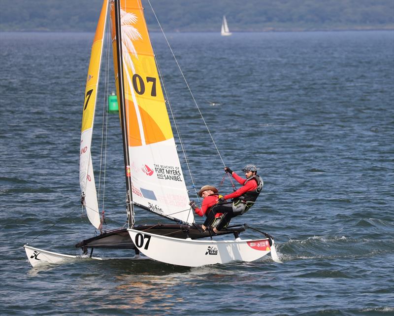 Christopher Dutton and his pinch-hit crew on the verge of flying a hull photo copyright Gayle Brouillard / Shoreline Photography taken at  and featuring the Hobie 16 class