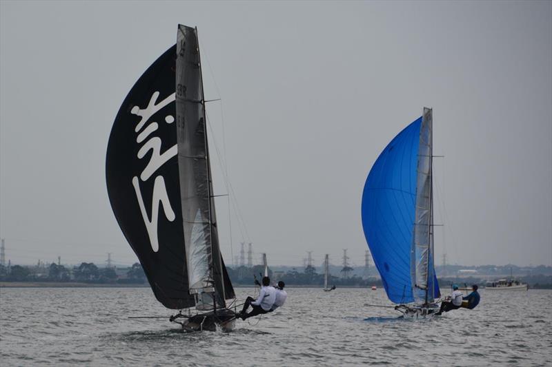 Britain's Glenn Truswell leads defending champion Archie Massey as they battle for first place on day 1 of the International 14 Worlds in Geelong photo copyright Rhenny Cunningham / Sailing Shots taken at Royal Geelong Yacht Club and featuring the International 14 class