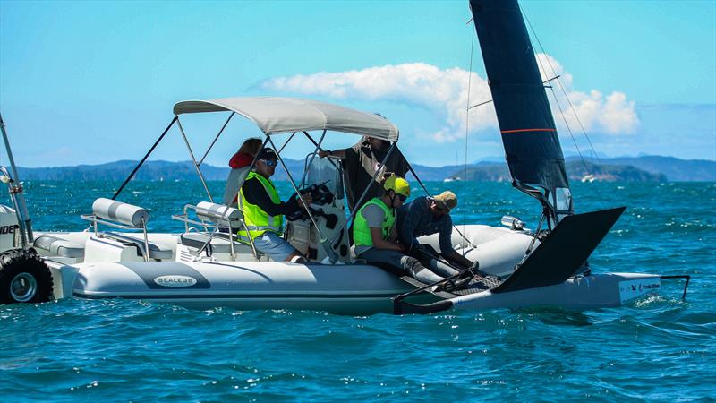 Mattias Coutts takes a break between races with his support team - Day 5 - 2024 PredictWind Moth Worlds - Manly Sailing Club. January 9, 2025 photo copyright Richard Gladwell - Sail-World.com/nz taken at Manly Sailing Club and featuring the International Moth class