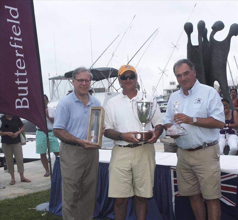 Andrew Weiss skipper of Christopher Dragon presented with the New York Yacht Club trophy by Bradford Kopp from Butterfield Bank, and Jonathan Brewin, RBYC Commodore at the Royal Bermuda Yacht Club Anniversary Regatta photo copyright Barry Pickthall / PPL taken at Royal Bermuda Yacht Club and featuring the IRC class