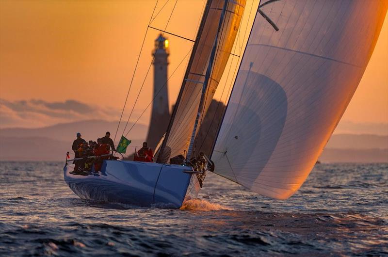 Chris Sheehan's PAC 52 Warrior Won rounds the Fastnet Rock in the 2023 Rolex Fastnet Race - photo © Rolex / Kurt Arrigo