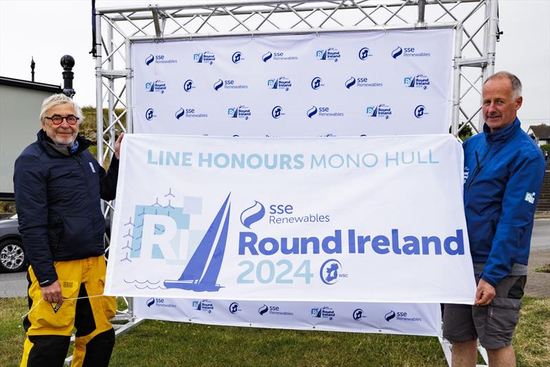 Teasing Machine skippered by Eric de Turckheim (left) competing for the Royal Ocean Racing Club and winner of monohull line honours in the SSE Renewables Round Ireland Race 2024 pictured with Race Director Kyran O'Grady of Wicklow Sailing Club photo copyright David Branigan / Oceansport taken at Wicklow Sailing Club and featuring the IRC class