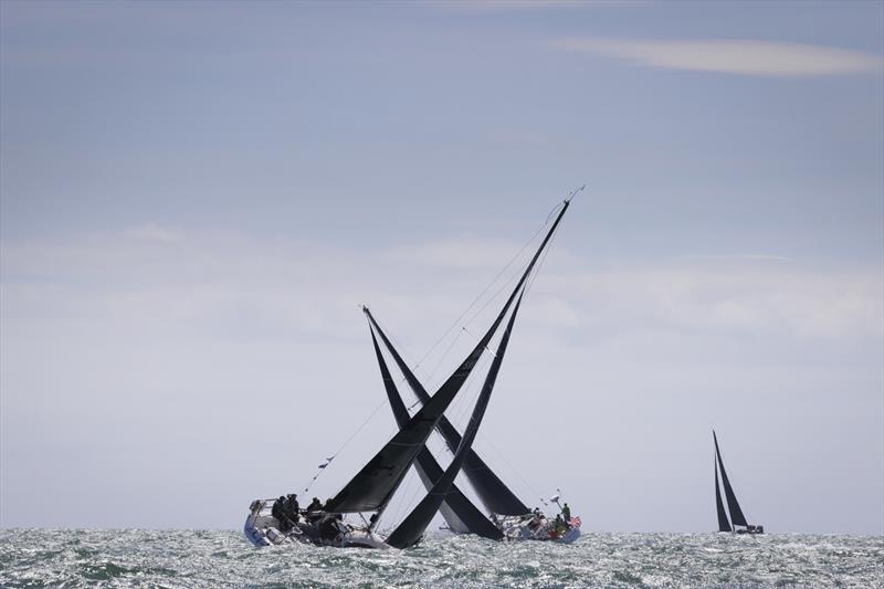 Prime Suspect entered by Keith Miller competing for the Kilmore Quay Boat Club crosses tacks with American yacht Hiro Maru entered by Hiroshi Nakajima competing for Stamford Yacht Club in the SSE Renewables Round Ireland Race 2024 photo copyright David Branigan / Oceansport taken at Wicklow Sailing Club and featuring the IRC class