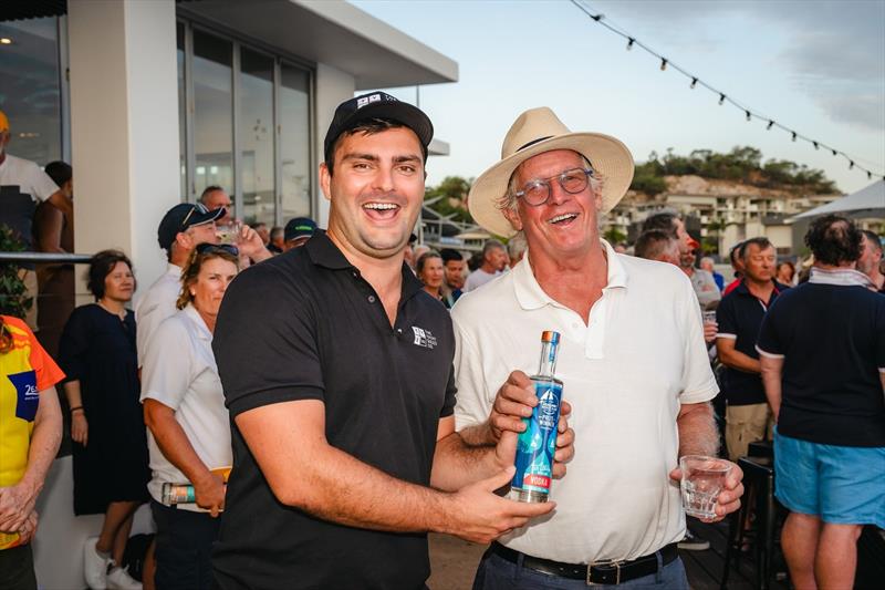 Julian Bethwaite (in hat) collects from Peter Austin after winning Race 4 - SeaLink Magnetic Island Race Week 2024 - photo © Revolution Productions, SMIRW