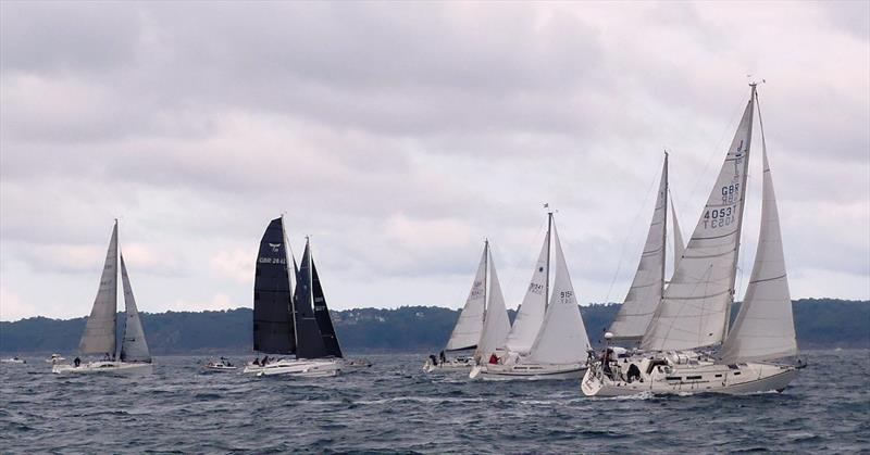 Triangle fleet start at St Cast during the Waller-Harris Two-handed Triangle Race photo copyright Bill Harris taken at Royal Channel Islands Yacht Club and featuring the IRC class