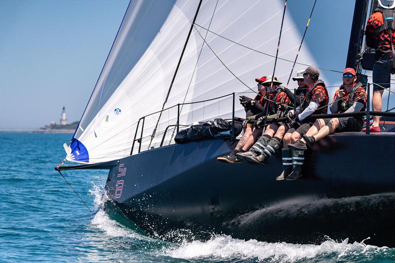 Sandringham yacht Scarlet Runner leads the fleet out of the Heads photo copyright Michael Currie taken at Ocean Racing Club of Victoria and featuring the IRC class