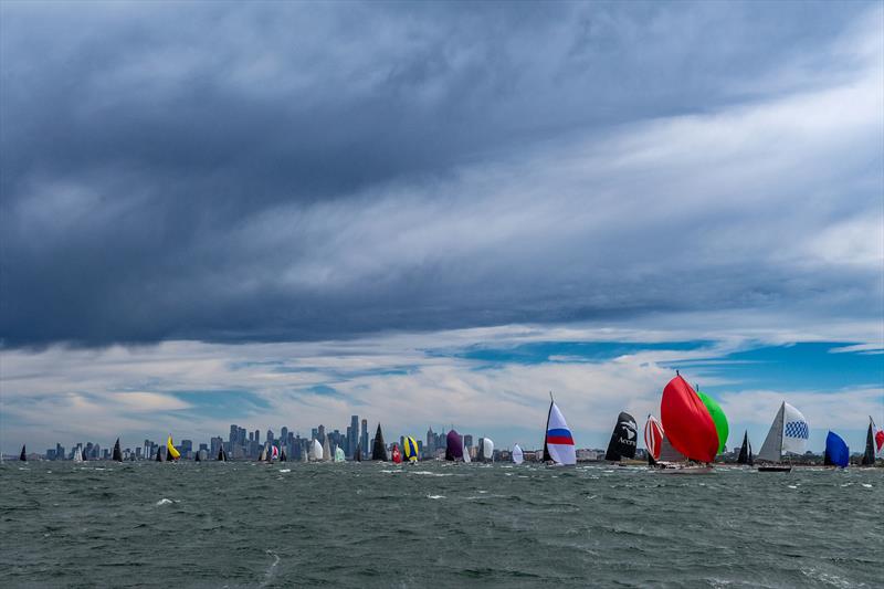 Spinnakers fill in the Melbourne skyline photo copyright Michael Currie taken at Ocean Racing Club of Victoria and featuring the IRC class